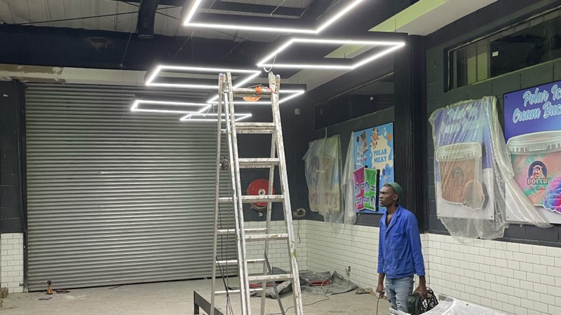 New linear light fittings and finishes going in along the retail wall.
